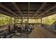 Covered porch with cluttered area needing cleanup at 90 Little Indian Creek Rd, Goldston, NC 27252