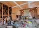 Unfinished attic space with exposed beams and storage at 90 Little Indian Creek Rd, Goldston, NC 27252