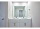 Double vanity bathroom with a large mirror and modern fixtures at 1108 Middlecrest Dr, Rocky Mount, NC 27804