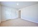 Well-lit bedroom with neutral walls and carpet, featuring double closets at 1108 Middlecrest Dr, Rocky Mount, NC 27804