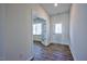 Bright foyer with wood-look floors and french doors leading to an office at 1108 Middlecrest Dr, Rocky Mount, NC 27804