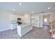 Open concept kitchen with island, stainless steel appliances, and hardwood floors at 1108 Middlecrest Dr, Rocky Mount, NC 27804