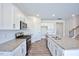 Kitchen with granite countertops, stainless steel appliances, and white cabinets at 1108 Middlecrest Dr, Rocky Mount, NC 27804