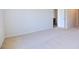 Spacious bedroom with carpeted floor and view of kitchen at 1117 Middlecrest Dr, Rocky Mount, NC 27804