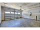 Unfinished two-car garage with concrete floor and garage door opener at 1117 Middlecrest Dr, Rocky Mount, NC 27804