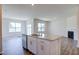 Modern kitchen with white cabinets, granite island, and stainless steel appliances at 1117 Middlecrest Dr, Rocky Mount, NC 27804