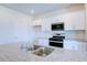 Modern kitchen with white cabinets, granite countertop and double sink at 1117 Middlecrest Dr, Rocky Mount, NC 27804