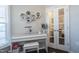 Home office with white desk, hexagonal shelves, and French doors at 1126 E Rosedale Creek Dr, Durham, NC 27703