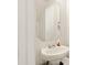 Clean bathroom with a pedestal sink and octagon mirror at 1134 Aster Way, Burlington, NC 27215