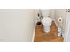 Clean bathroom with toilet and wood-look flooring at 1134 Aster Way, Burlington, NC 27215