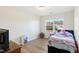Charming bedroom with wood floors and a twin-sized bed at 1134 Aster Way, Burlington, NC 27215