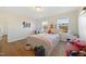 Well-lit bedroom with a queen bed and built-in shelving at 1134 Aster Way, Burlington, NC 27215