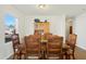 Bright dining room featuring a wooden table with chairs and built-in hutch at 1134 Aster Way, Burlington, NC 27215