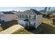 Two-story house with gray siding, a white door, and a two-car garage at 1134 Aster Way, Burlington, NC 27215