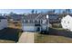 Two-story house with gray siding, a white door, and a two-car garage at 1134 Aster Way, Burlington, NC 27215