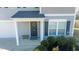 Front entrance with a wreath and a small bench at 1134 Aster Way, Burlington, NC 27215