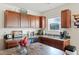 Kitchen boasts wood cabinets, double sink, and modern appliances at 1134 Aster Way, Burlington, NC 27215