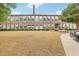 Brick building exterior with landscaping and ample parking at 1535 Caraleigh Mills Ct # 221, Raleigh, NC 27603