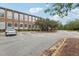 Brick building exterior with parking and landscaping at 1535 Caraleigh Mills Ct # 221, Raleigh, NC 27603