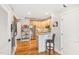 Kitchen features a breakfast bar and stainless steel refrigerator at 1535 Caraleigh Mills Ct # 221, Raleigh, NC 27603