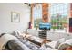 Living area with leather couches, coffee table, and built in shelving at 1535 Caraleigh Mills Ct # 221, Raleigh, NC 27603