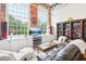 Living room with a large TV, comfy seating, and built-in shelving at 1535 Caraleigh Mills Ct # 221, Raleigh, NC 27603