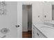 Clean bathroom with white tile and marble vanity at 1621 Sutton Dr, Raleigh, NC 27605