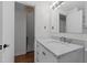 Bathroom with marble countertop, sink, and view of upper floor at 1621 Sutton Dr, Raleigh, NC 27605