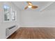 Spacious bedroom with hardwood floors and plenty of natural light at 1621 Sutton Dr, Raleigh, NC 27605