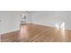 Hardwood floors and ample space for furniture in this well-lit bedroom at 1621 Sutton Dr, Raleigh, NC 27605