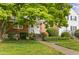 Charming brick townhouse with a welcoming front entrance and lush landscaping at 1621 Sutton Dr, Raleigh, NC 27605