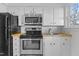 Updated kitchen featuring stainless steel appliances and wood countertops at 1621 Sutton Dr, Raleigh, NC 27605
