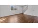 Spacious living room featuring hardwood floors and natural light at 1621 Sutton Dr, Raleigh, NC 27605