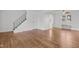 Bright living room with hardwood floors and staircase at 1621 Sutton Dr, Raleigh, NC 27605