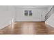 Hardwood floors and an entrance with staircase in living room at 1621 Sutton Dr, Raleigh, NC 27605