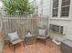 Charming brick patio featuring a seating area with comfortable outdoor furniture at 1621 Sutton Dr, Raleigh, NC 27605