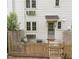 Private patio with charming fence and comfortable seating area off the side of the house at 1621 Sutton Dr, Raleigh, NC 27605