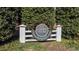 Entrance to Cameron Village Condominiums with mature bushes in the background at 1621 Sutton Dr, Raleigh, NC 27605