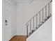 Modern black metal railing staircase with wood flooring at 1621 Sutton Dr, Raleigh, NC 27605
