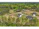 Beautiful aerial view of new construction homes in a wooded community with landscaped yards and well-maintained roadways at 18 Hewitt Woods Dr, Clayton, NC 27527