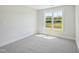Bright bedroom with a large window offering a view of the outdoors at 18 Hewitt Woods Dr, Clayton, NC 27527