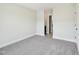 A view of the bright bedroom leading to an adjoining bathroom at 18 Hewitt Woods Dr, Clayton, NC 27527