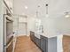 Modern kitchen with stainless steel appliances, a center island with sink, and stylish pendant lighting at 18 Hewitt Woods Dr, Clayton, NC 27527