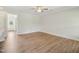 Spacious living room with luxury vinyl plank flooring, large windows, and ample natural light at 18 Hewitt Woods Dr, Clayton, NC 27527