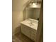 Bright bathroom vanity with mirror, sink, and storage at 2324 Lonnie Cir, Hillsborough, NC 27278