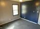 A bedroom with gray and blue walls, window, and ceiling fan at 2324 Lonnie Cir, Hillsborough, NC 27278