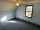 Bedroom featuring a ceiling fan, window, and sloped ceilings at 2324 Lonnie Cir, Hillsborough, NC 27278