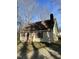 Charming home featuring a brick chimney, red shutters, and a cozy atmosphere at 2324 Lonnie Cir, Hillsborough, NC 27278