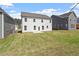 Large backyard space, with an expansive lawn, providing ample room for recreation at 257 North Maple Walk Dr # 218, Garner, NC 27529