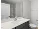 Bathroom featuring a single sink with quartz countertop, toilet, and tub-shower combo at 257 North Maple Walk Dr # 218, Garner, NC 27529